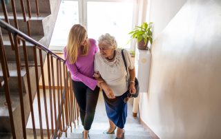 Caregiver,Helping,Senior,Woman,Climb,Staircase